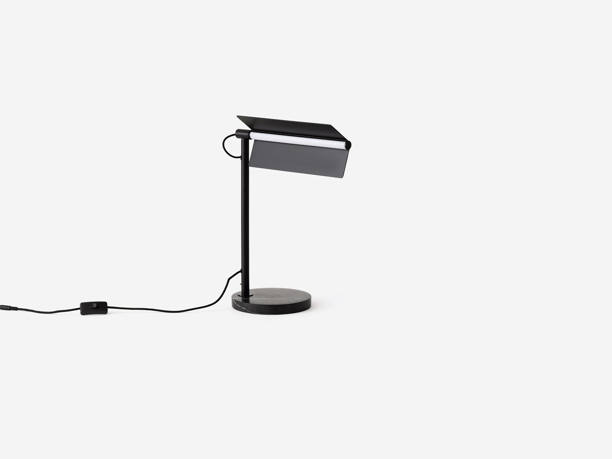 Angled view of the Oxford side table lamp in black with shade angled up